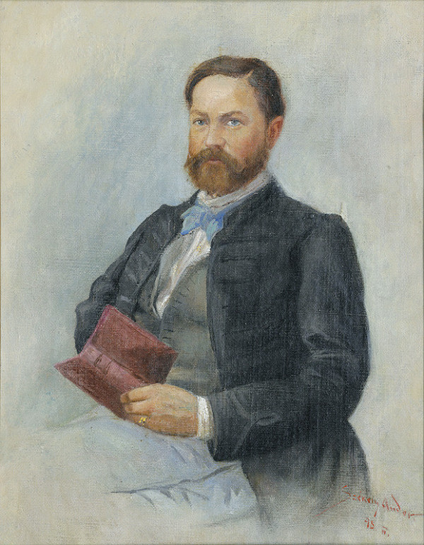 André Székély – Portrét s knihou 